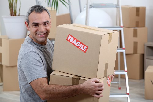 Organised household storage unit with boxes and furniture in Canarywharf